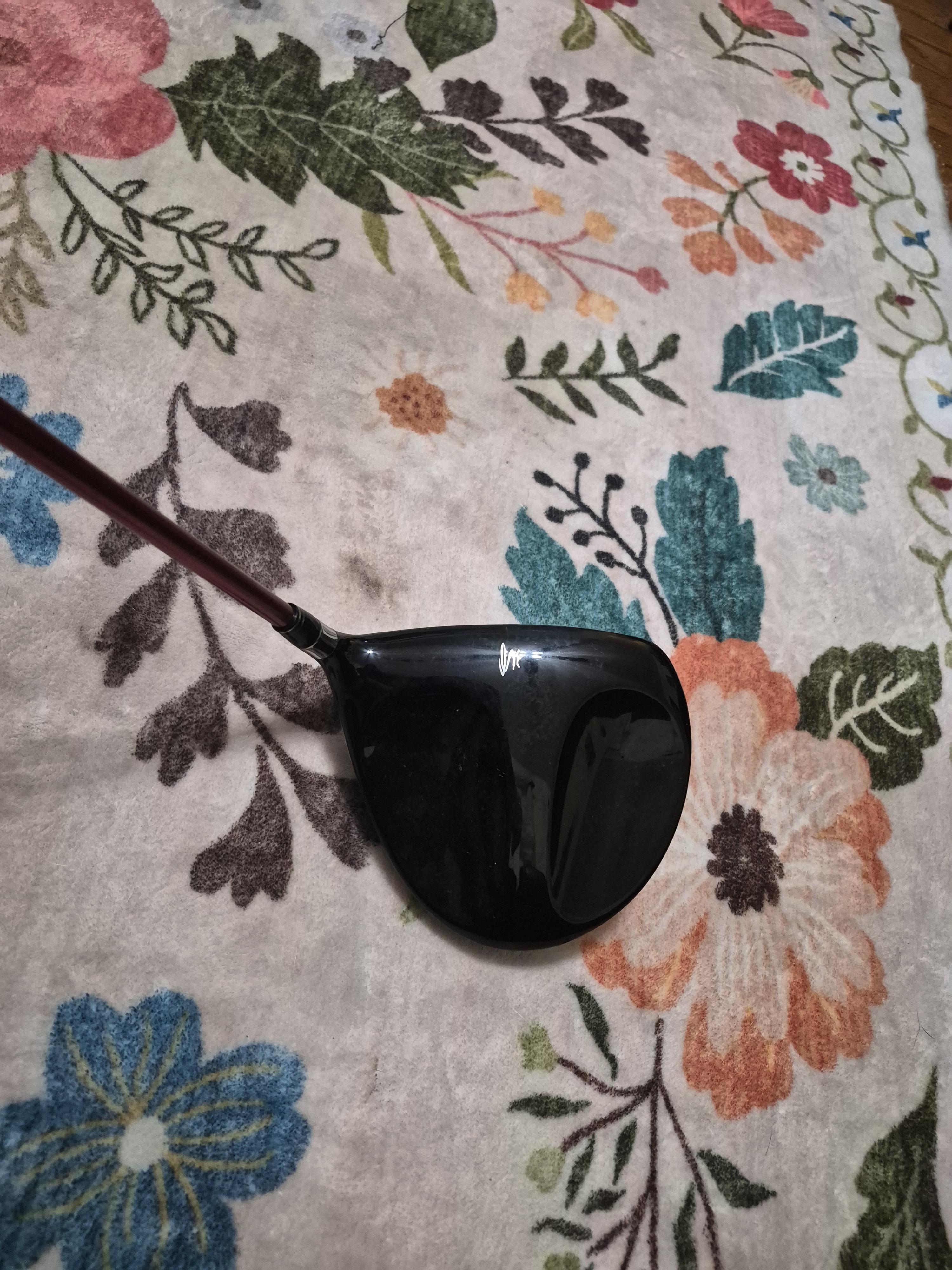 Black Golf Driver Head With Burgundy Shaft